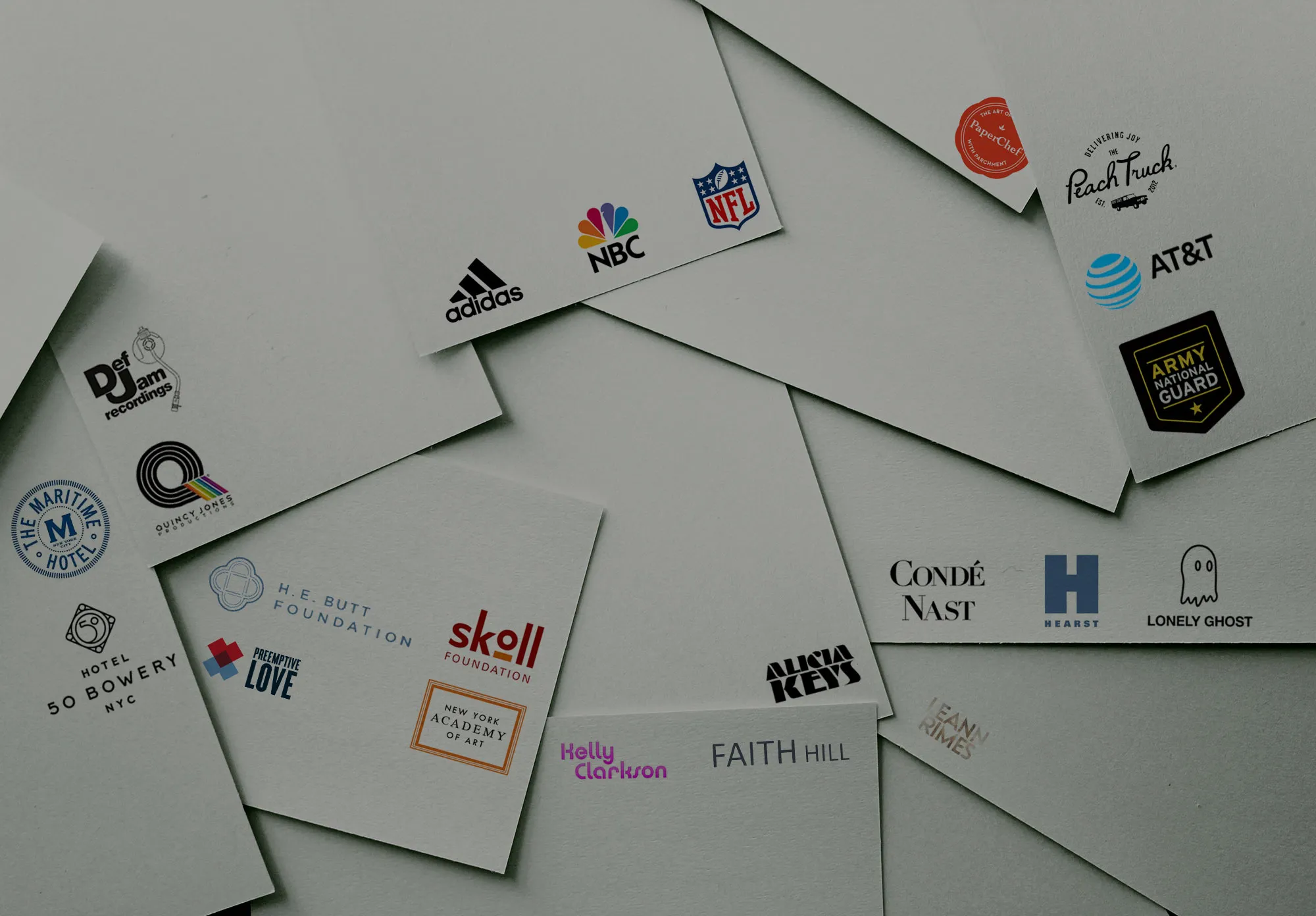 Scattered business cards featuring logos of Waterloo Digital clients